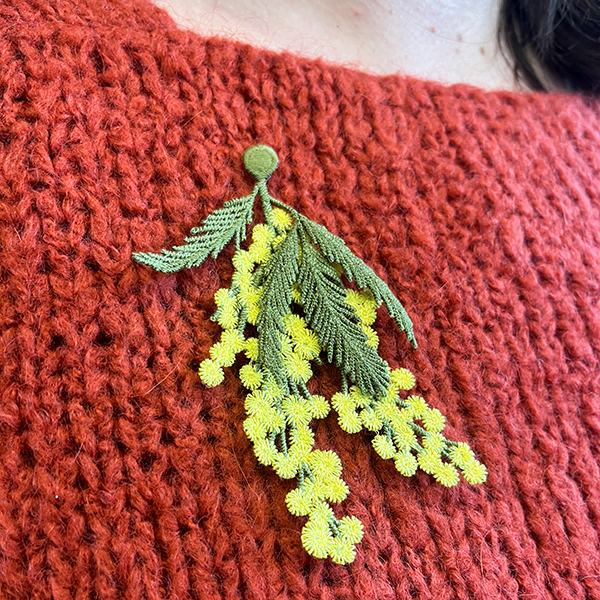 Mimosa flowers embroidered brooch on knitted sweater